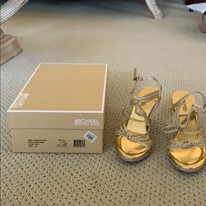Micheal Kors gold wedges